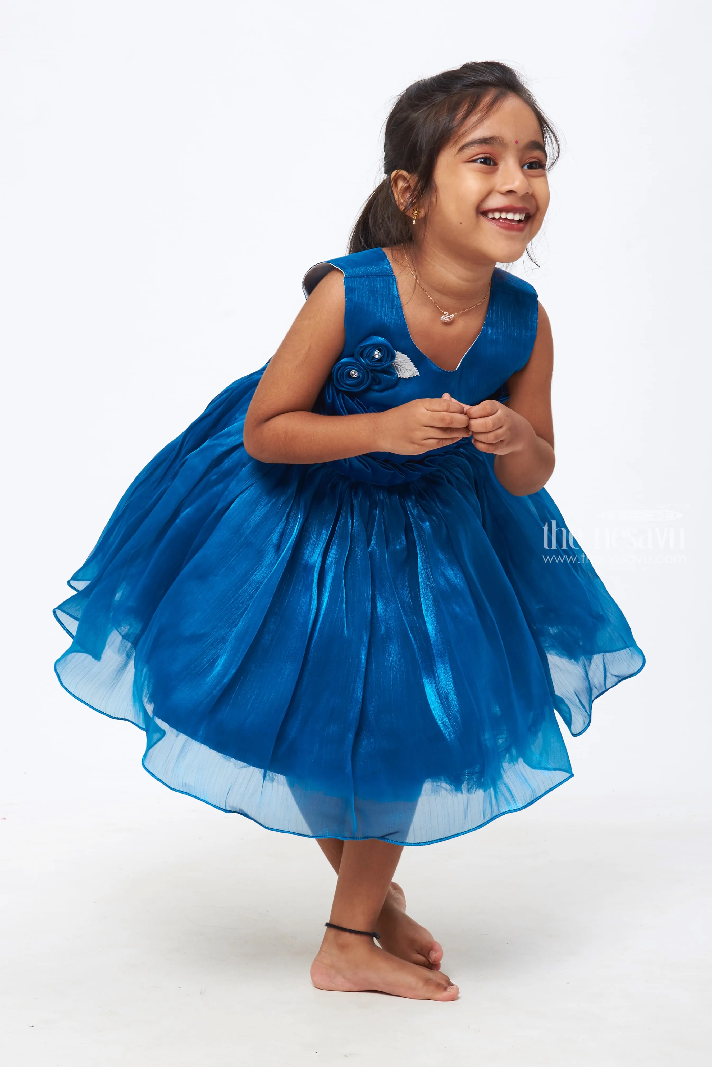 Azure Elegance: Girls Deep Blue Tulle Dress with Rosette Embellishments