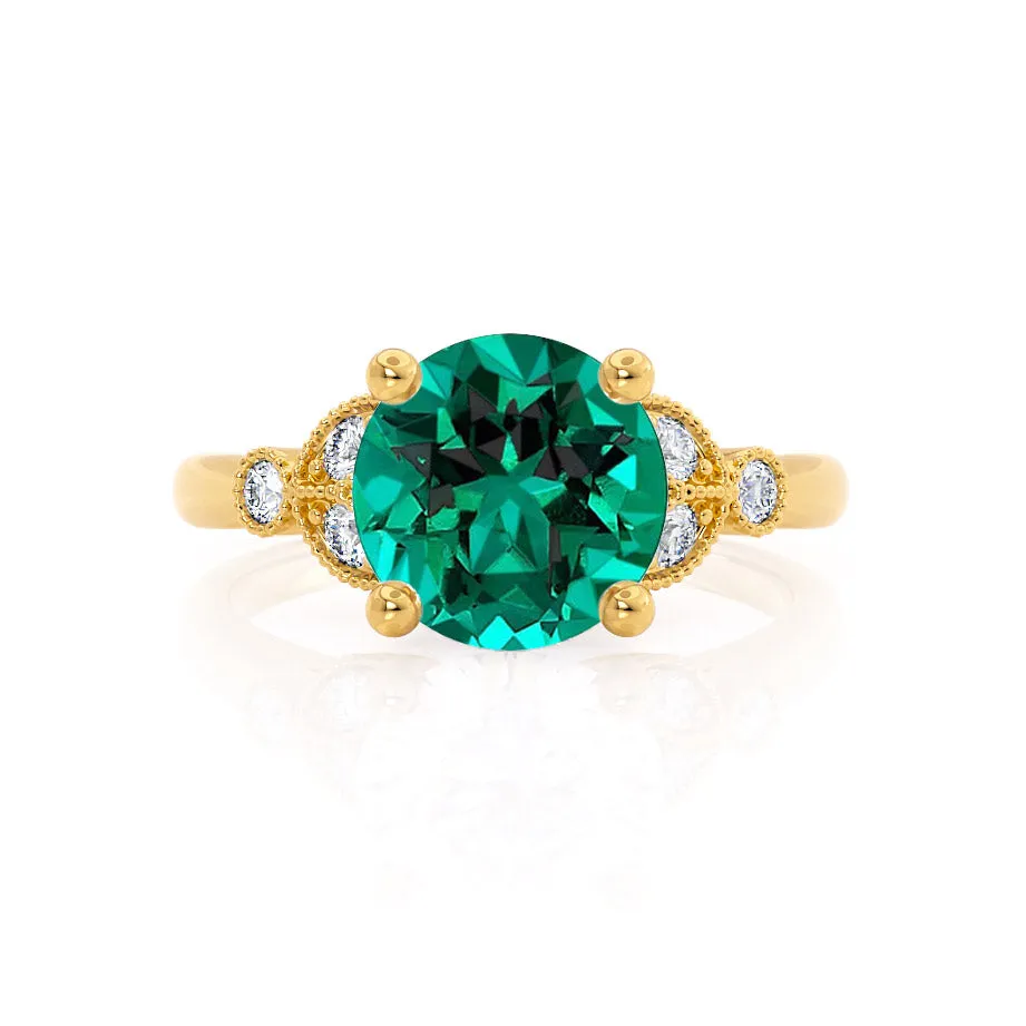 DELILAH - Chatham® Round Emerald 18k Yellow Gold Shoulder Set Ring