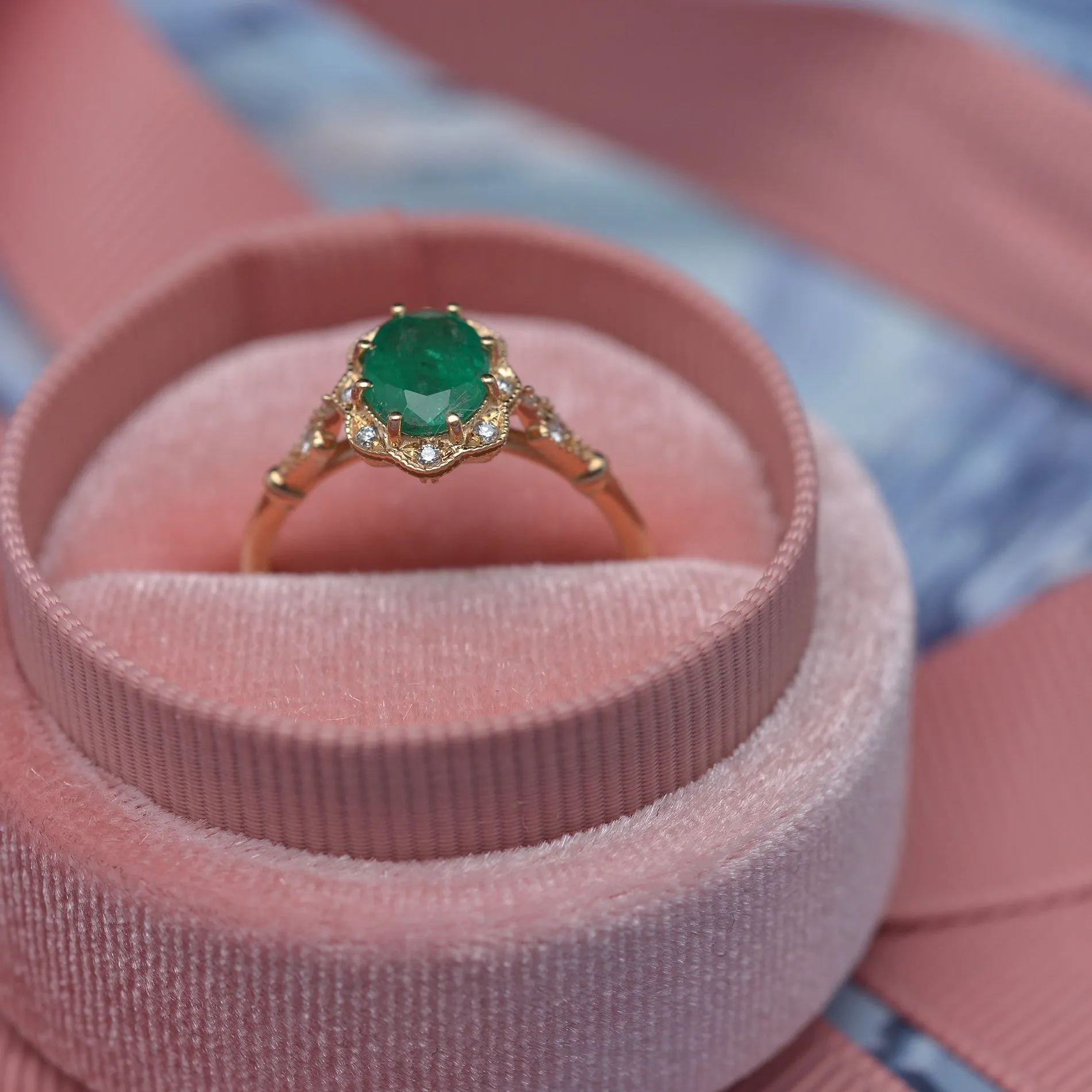 Natural Green Zambian Emerald in a Daisy Oval engagement ring