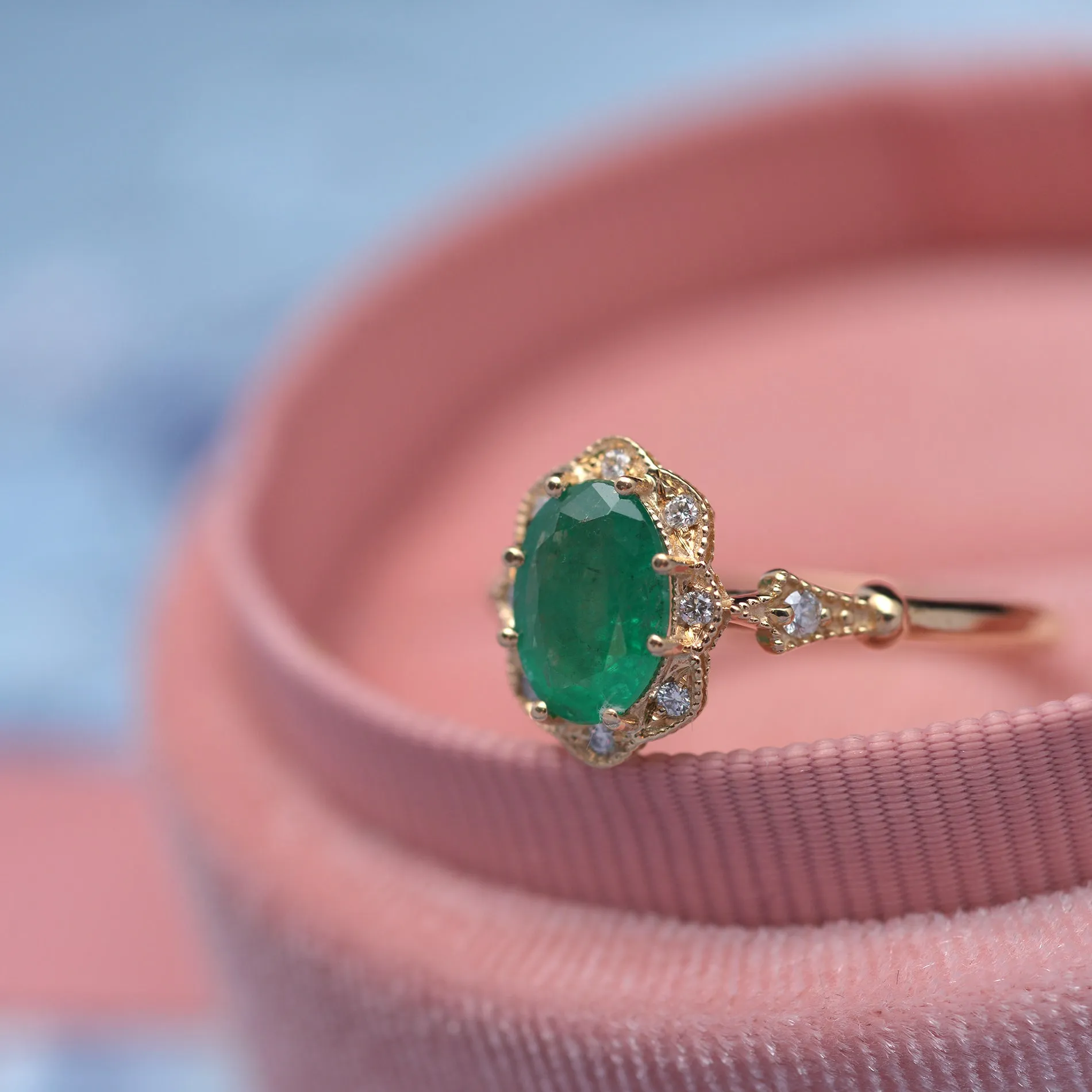 Natural Green Zambian Emerald in a Daisy Oval engagement ring